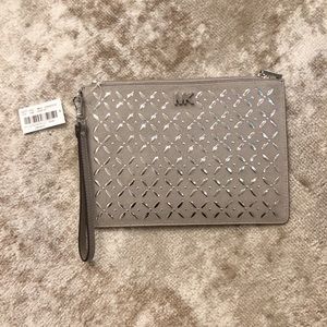 Brand new, never used, Michael Kors clutch. Grey.